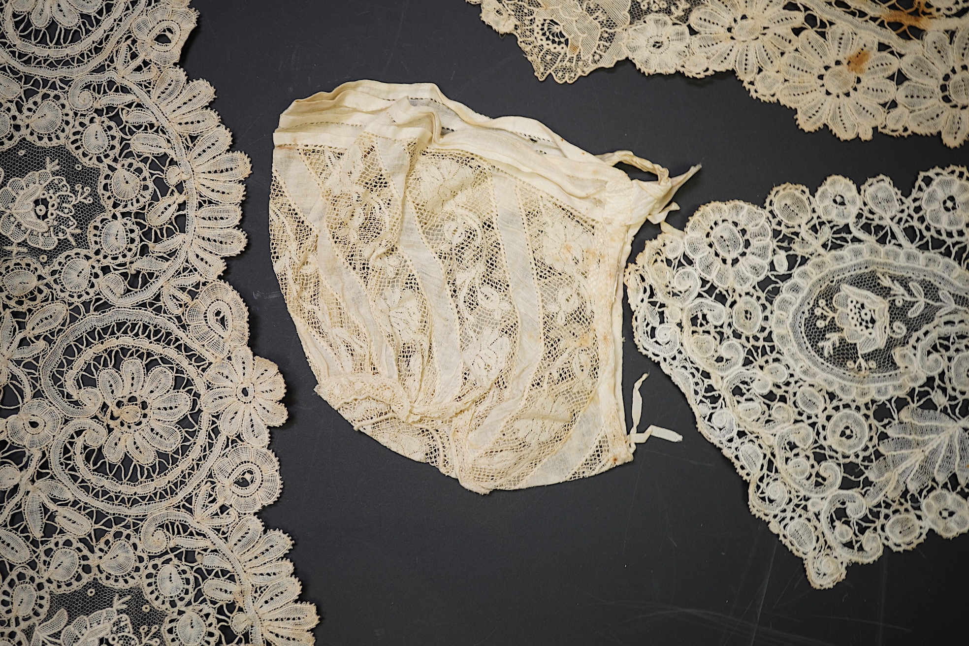 A mixed Brussels bobbin lace and Point de Gaze lace collar, another smaller collar, a similar length of trim and butterfly motif, together with a Brussels bobbin collar and trim, an Irish crochet cuffs, a Valenciennes la